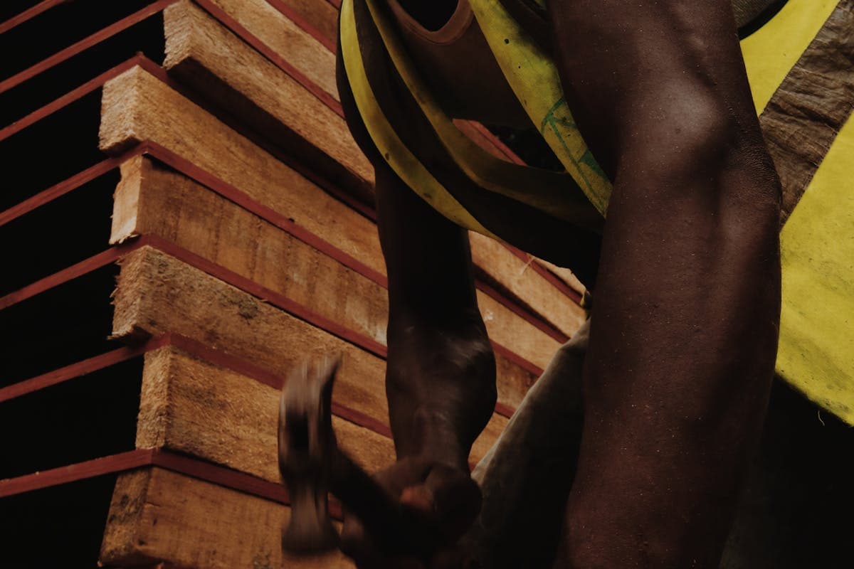 A Cameroonian worker in a well-paying manual trade — no university degree required