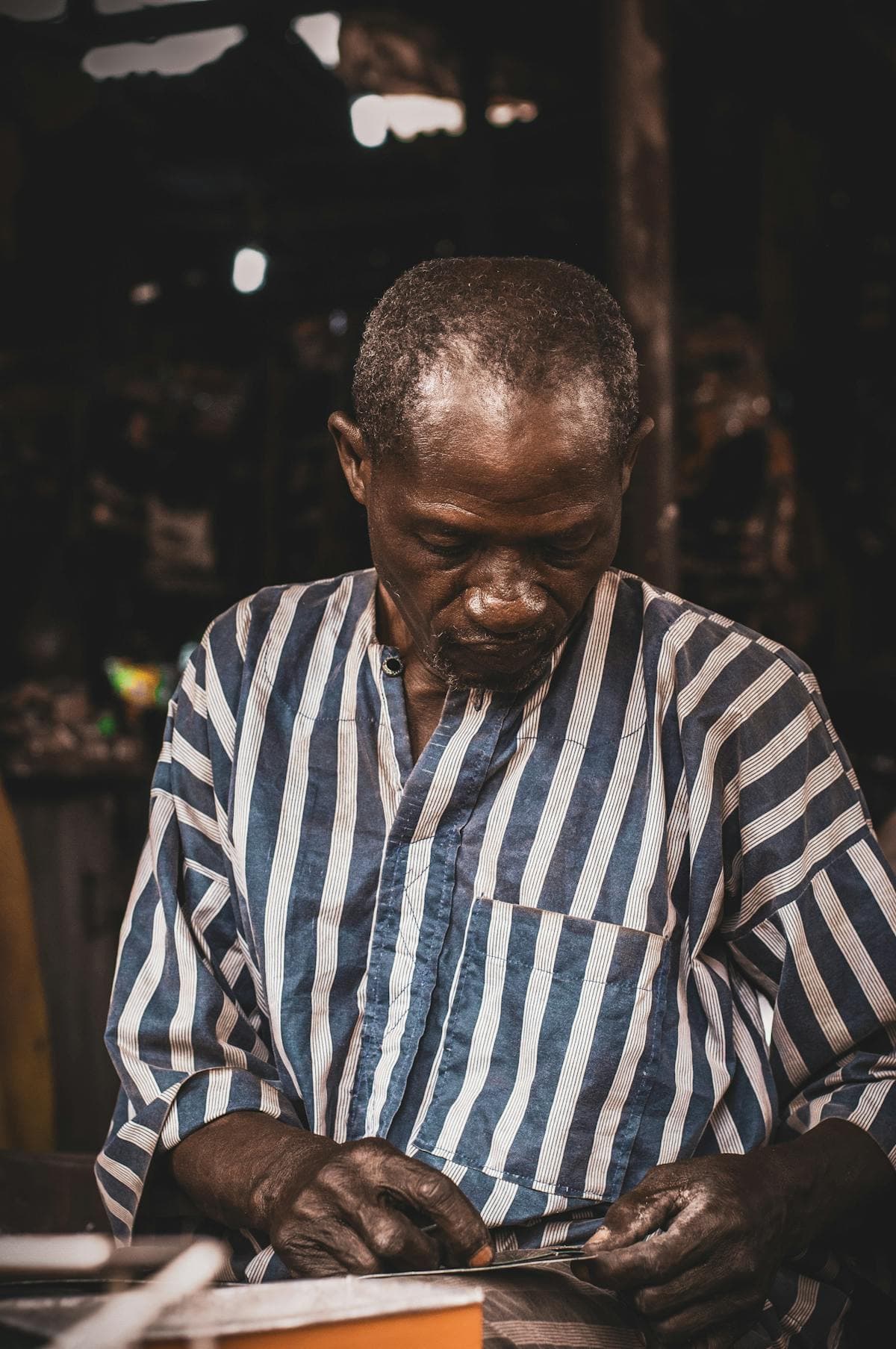 A Cameroonian craftsman at work — finding a job in Douala without a CV